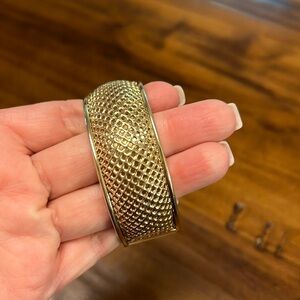 Gold toned bangle bracelet